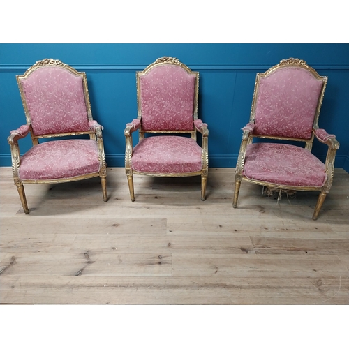 913 - Set of three French decorative giltwood and upholstered armchairs in the Louis XVI manner raised on ... 