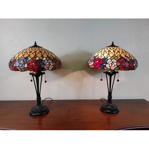 92 - Pair of metal and stained glass lamps in the Tiffany style {66 cm H x 44 cm Dia.}.