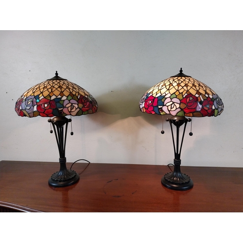 92 - Pair of metal and stained glass lamps in the Tiffany style {66 cm H x 44 cm Dia.}.