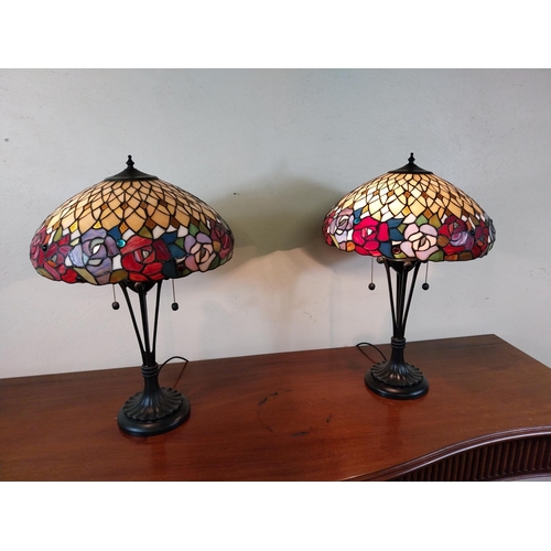 92 - Pair of metal and stained glass lamps in the Tiffany style {66 cm H x 44 cm Dia.}.