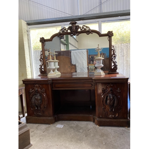 921 - 19th C. heavily carved mahogany sideboard with mirrored back and pheasant decoration {240 cm H 230 c... 