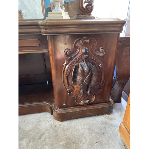 921 - 19th C. heavily carved mahogany sideboard with mirrored back and pheasant decoration {240 cm H 230 c... 