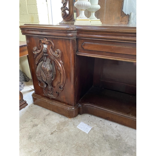 921 - 19th C. heavily carved mahogany sideboard with mirrored back and pheasant decoration {240 cm H 230 c... 