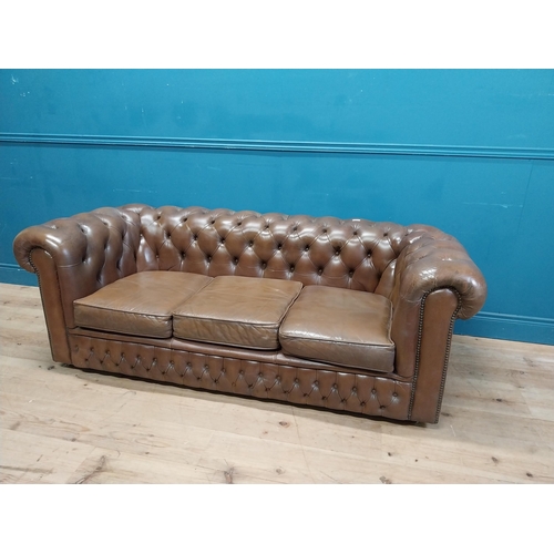 98 - Good quality leather deep buttoned Chesterfield three seater sofa {70 cm H x 190 cm W x 87 cm D}.