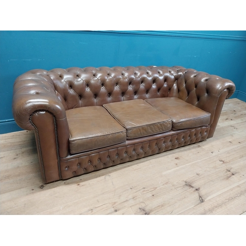 98 - Good quality leather deep buttoned Chesterfield three seater sofa {70 cm H x 190 cm W x 87 cm D}.