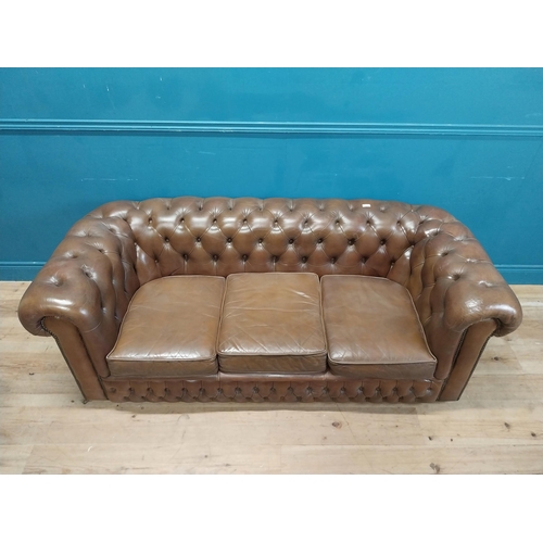 98 - Good quality leather deep buttoned Chesterfield three seater sofa {70 cm H x 190 cm W x 87 cm D}.