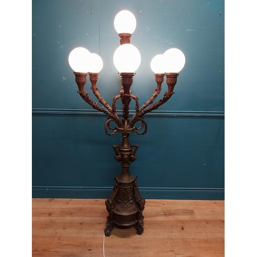 103 - Pair of decorative bronze floor candelabras with opaline glass shades {174 cm H x 75 cm Dia.}.