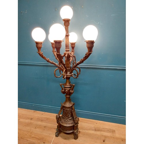 103 - Pair of decorative bronze floor candelabras with opaline glass shades {174 cm H x 75 cm Dia.}.