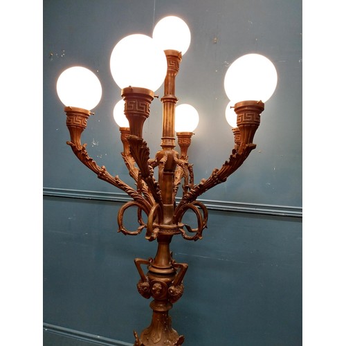 103 - Pair of decorative bronze floor candelabras with opaline glass shades {174 cm H x 75 cm Dia.}.