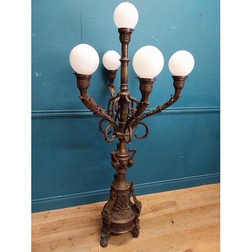 103 - Pair of decorative bronze floor candelabras with opaline glass shades {174 cm H x 75 cm Dia.}.