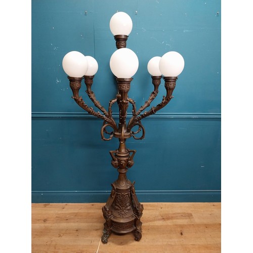 103 - Pair of decorative bronze floor candelabras with opaline glass shades {174 cm H x 75 cm Dia.}.