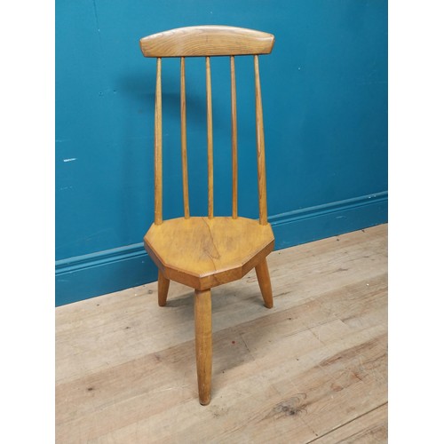 107 - 1950s pine childs chair raised on three tapered legs {74 cm H x 34 cm W x 37 cm D}.