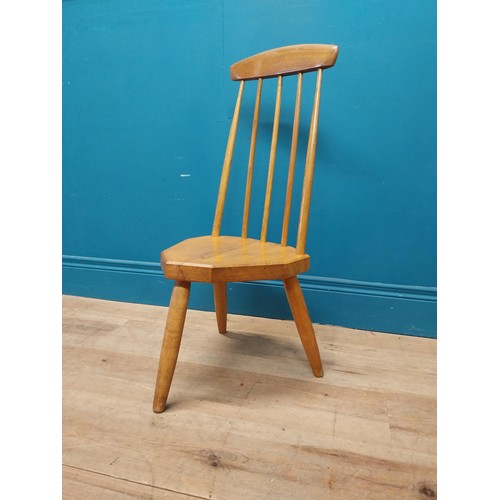 107 - 1950s pine childs chair raised on three tapered legs {74 cm H x 34 cm W x 37 cm D}.