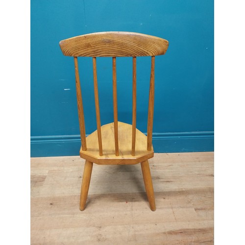 107 - 1950s pine childs chair raised on three tapered legs {74 cm H x 34 cm W x 37 cm D}.