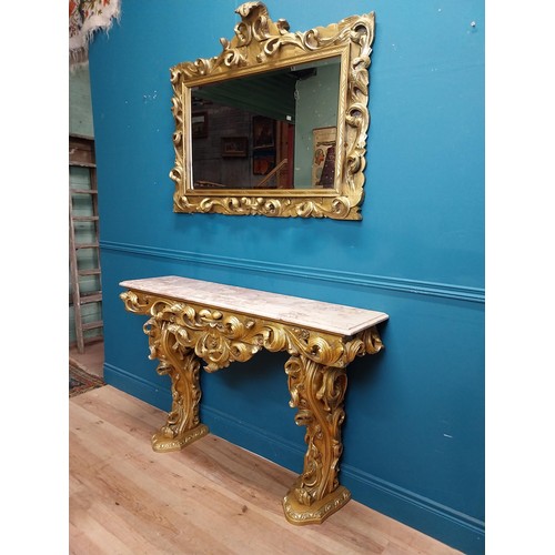 108 - Highly carved Gilt console table with marble top and matching mirror in the Rococo style. {87 cm H x... 