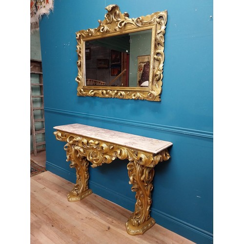 108 - Highly carved Gilt console table with marble top and matching mirror in the Rococo style. {87 cm H x... 