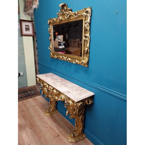 108 - Highly carved Gilt console table with marble top and matching mirror in the Rococo style. {87 cm H x... 