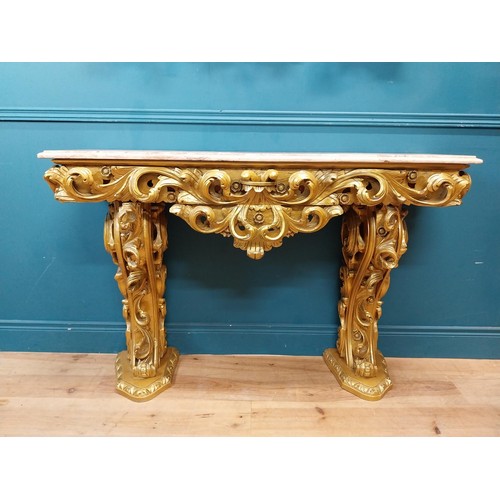 108 - Highly carved Gilt console table with marble top and matching mirror in the Rococo style. {87 cm H x... 