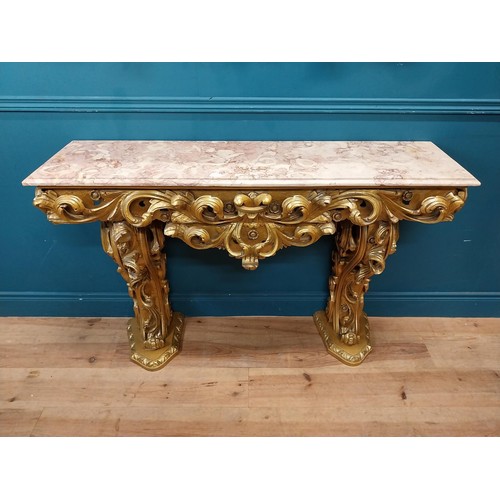 108 - Highly carved Gilt console table with marble top and matching mirror in the Rococo style. {87 cm H x... 