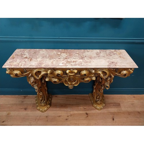 108 - Highly carved Gilt console table with marble top and matching mirror in the Rococo style. {87 cm H x... 