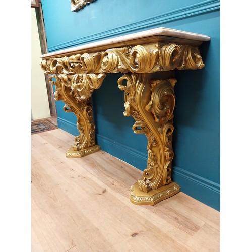 108 - Highly carved Gilt console table with marble top and matching mirror in the Rococo style. {87 cm H x... 