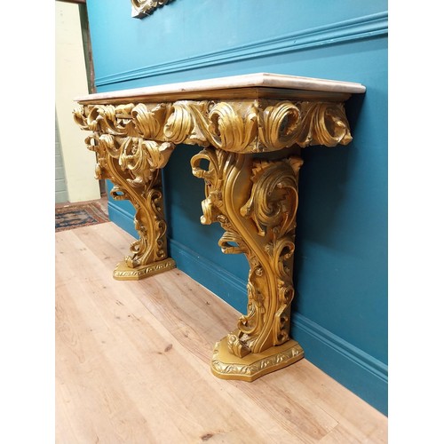 108 - Highly carved Gilt console table with marble top and matching mirror in the Rococo style. {87 cm H x... 