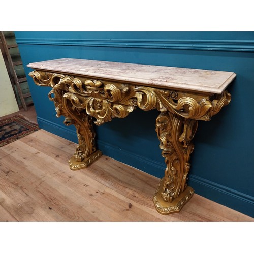 108 - Highly carved Gilt console table with marble top and matching mirror in the Rococo style. {87 cm H x... 