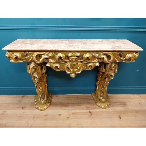 108 - Highly carved Gilt console table with marble top and matching mirror in the Rococo style. {87 cm H x... 