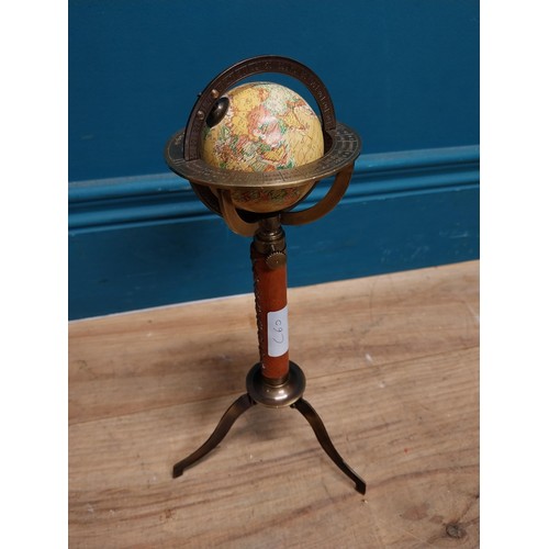 110 - Brass and leather desk globe on tripod stand. {30 cm H x 15 cm Dia.}.