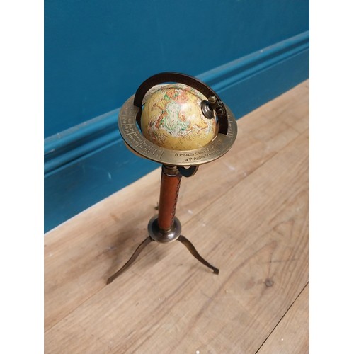 110 - Brass and leather desk globe on tripod stand. {30 cm H x 15 cm Dia.}.