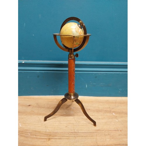 110 - Brass and leather desk globe on tripod stand. {30 cm H x 15 cm Dia.}.