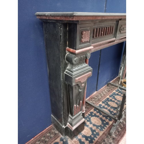 111 - Decorative 19th. C. black and maroon marble chimney piece, the legs in the form of  corinthain colum... 