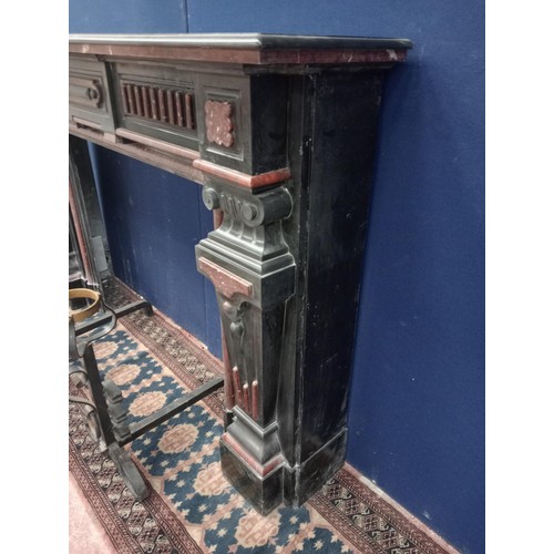 111 - Decorative 19th. C. black and maroon marble chimney piece, the legs in the form of  corinthain colum... 