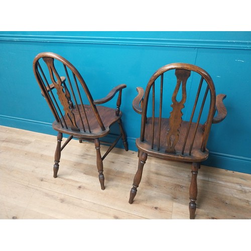 115 - Pair of ash and elm Windsor arm chairs {100 cm H x 60 cm W x 60 cm D}.