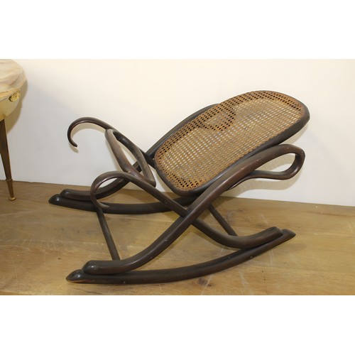 756 - Bentwood rocking foot rest with rattan base. { 40cm H X 67cm W X 38cm D }.