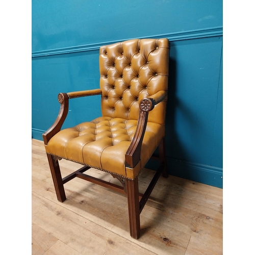 172 - Mahogany deep buttoned leather upholstered Gainsborough armchair with upholstered arms terminating i... 