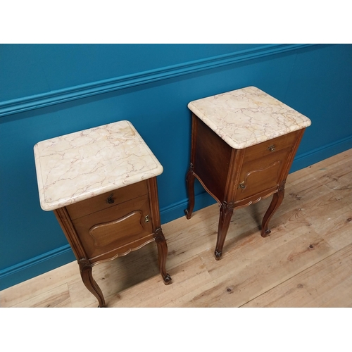 935 - Pair of 19th C. mahogany bedside cabinets with single drawer above panel door and marble tops raised... 