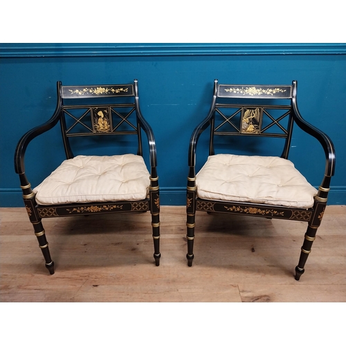 953 - Pair of good quality ebonised and gilded open armchairs in the Empire style with upholstered and ber... 