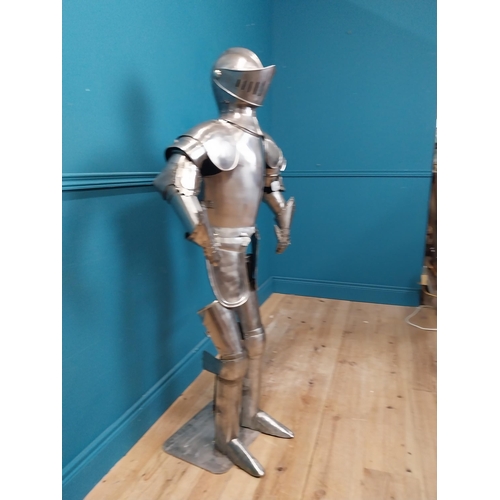 954 - Metal Suit of Armour. {140 cm H x 75 cm W x 46 cm D}.