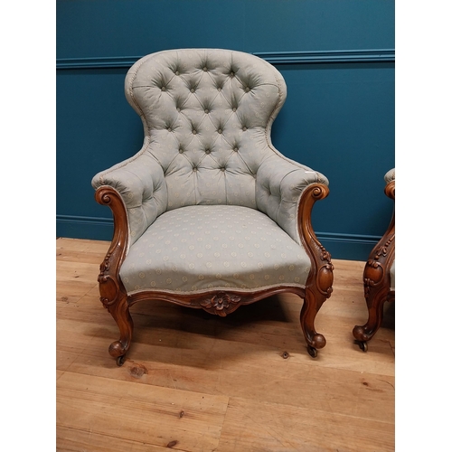 962 - Pair of mahogany and upholstered armchairs raised on cabriole legs {102 cm H x 78 cm W x 83 cm D}.