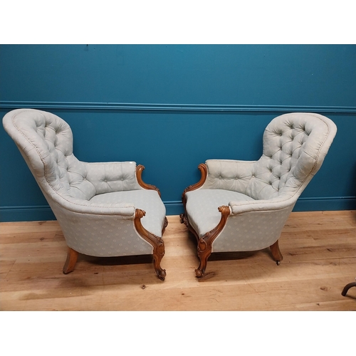 962 - Pair of mahogany and upholstered armchairs raised on cabriole legs {102 cm H x 78 cm W x 83 cm D}.