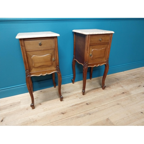 935 - Pair of 19th C. mahogany bedside cabinets with single drawer above panel door and marble tops raised... 