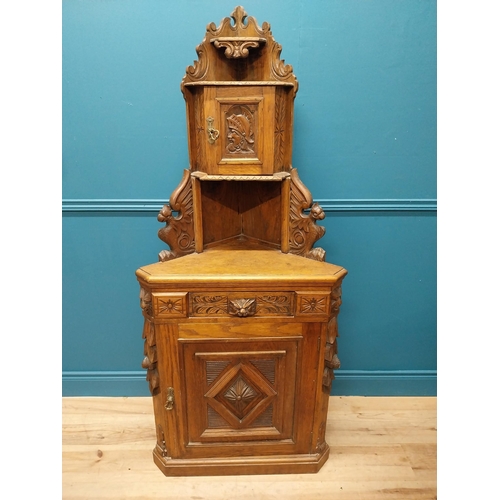 960 - 19th. C. carved oak corner cupboard with two blind doors and single drawer in the frieze {170 cm H x... 