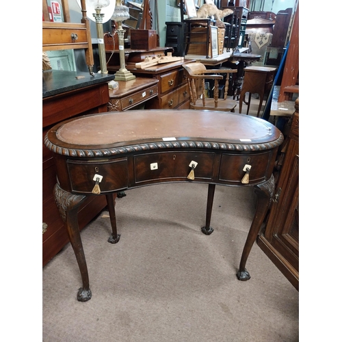 964 - Edwardian mahogany kidney shaped ladies desk with inset leather top {76 cm H x 92 cm W x 52 cm D}.