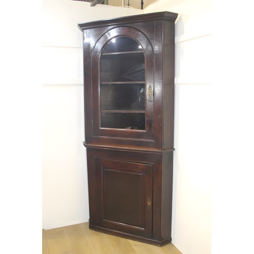 180 - 19th. C. oak corner cabinet the glazed arched door above a panelled door  { 213cm H X 97cm W X 64cm ... 