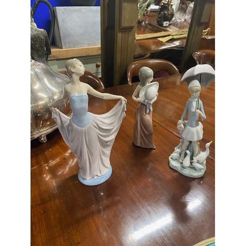 986 - Three Lladro figurines. { 31cm H, 29cm H & 29cm H }.