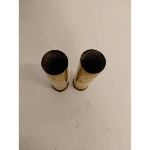 102 - Two WWI brass shells. {21 cm H x 6 Dia.}