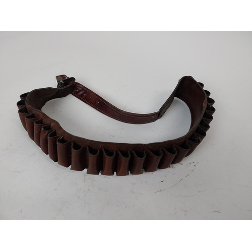 119 - Leather cartridge belt. {24 cm L}.