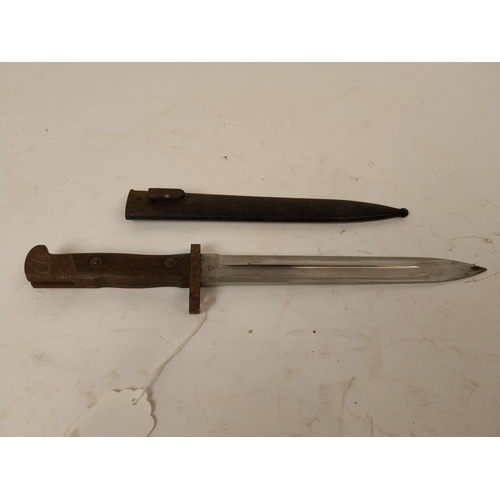 121 - Early 20th C. rifle bayonet in metal scabbard. {39 cm L}.