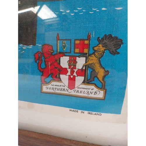 140 - Framed coloured tea towel of Arms Ship Mountjoy II. {65 cm H x 85 cm W}.